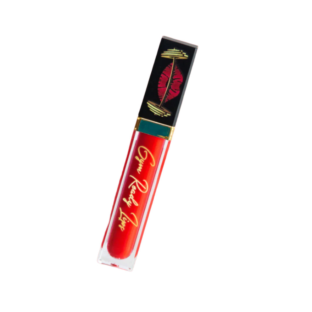 Red lip gloss tube with black and gold packaging on a white background