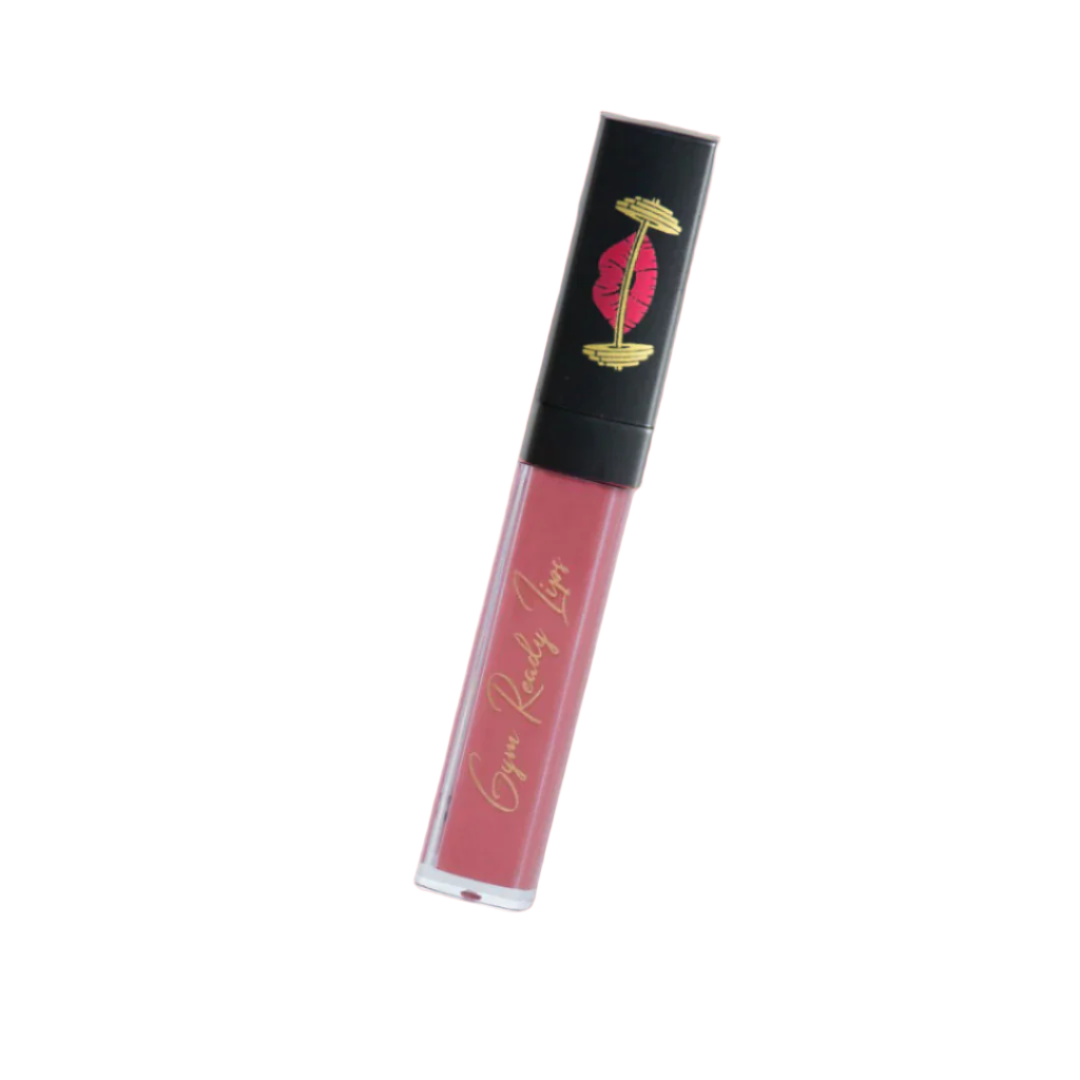 Pink lip gloss tube with black cap on white background