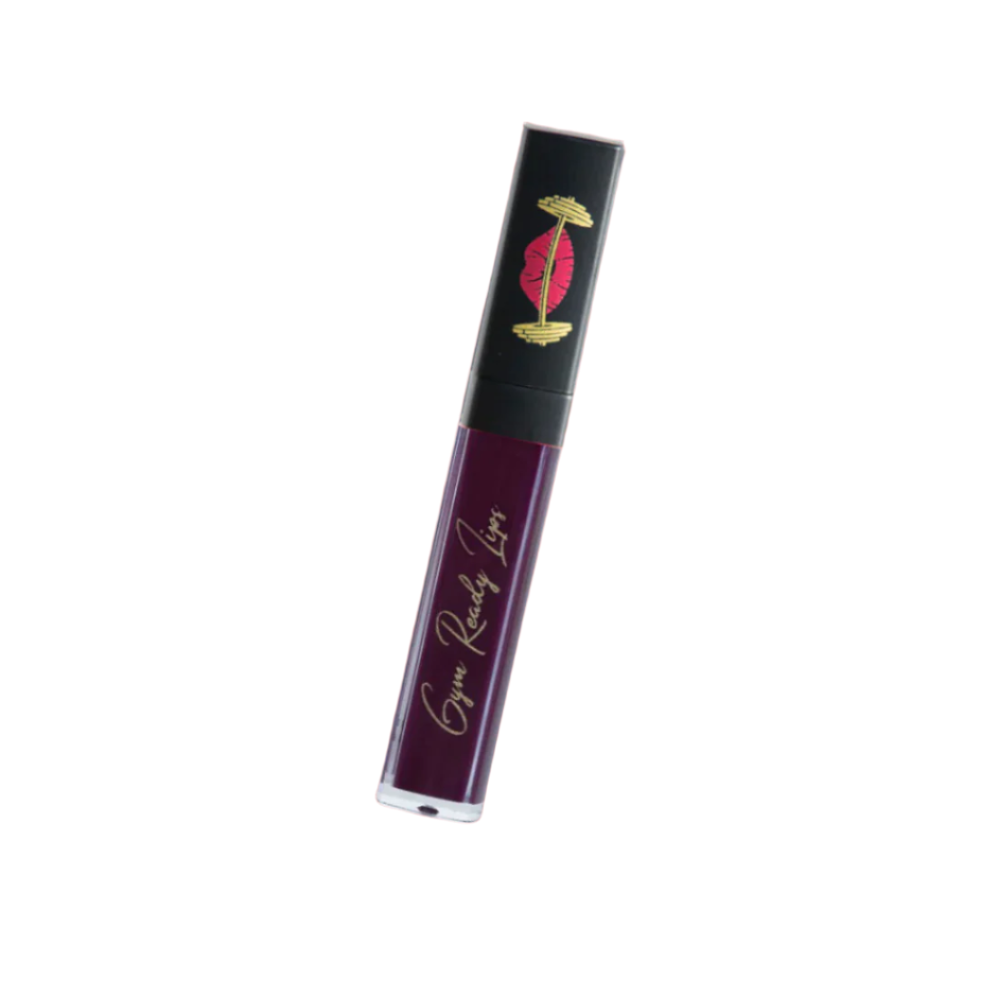 Lip gloss tube with black and gold packaging on a white background